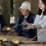 Visitors of the Meiji Shrine washing their hands before praying